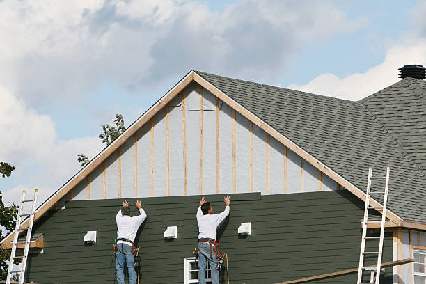 Professional Siding technician working in Diamond, IL